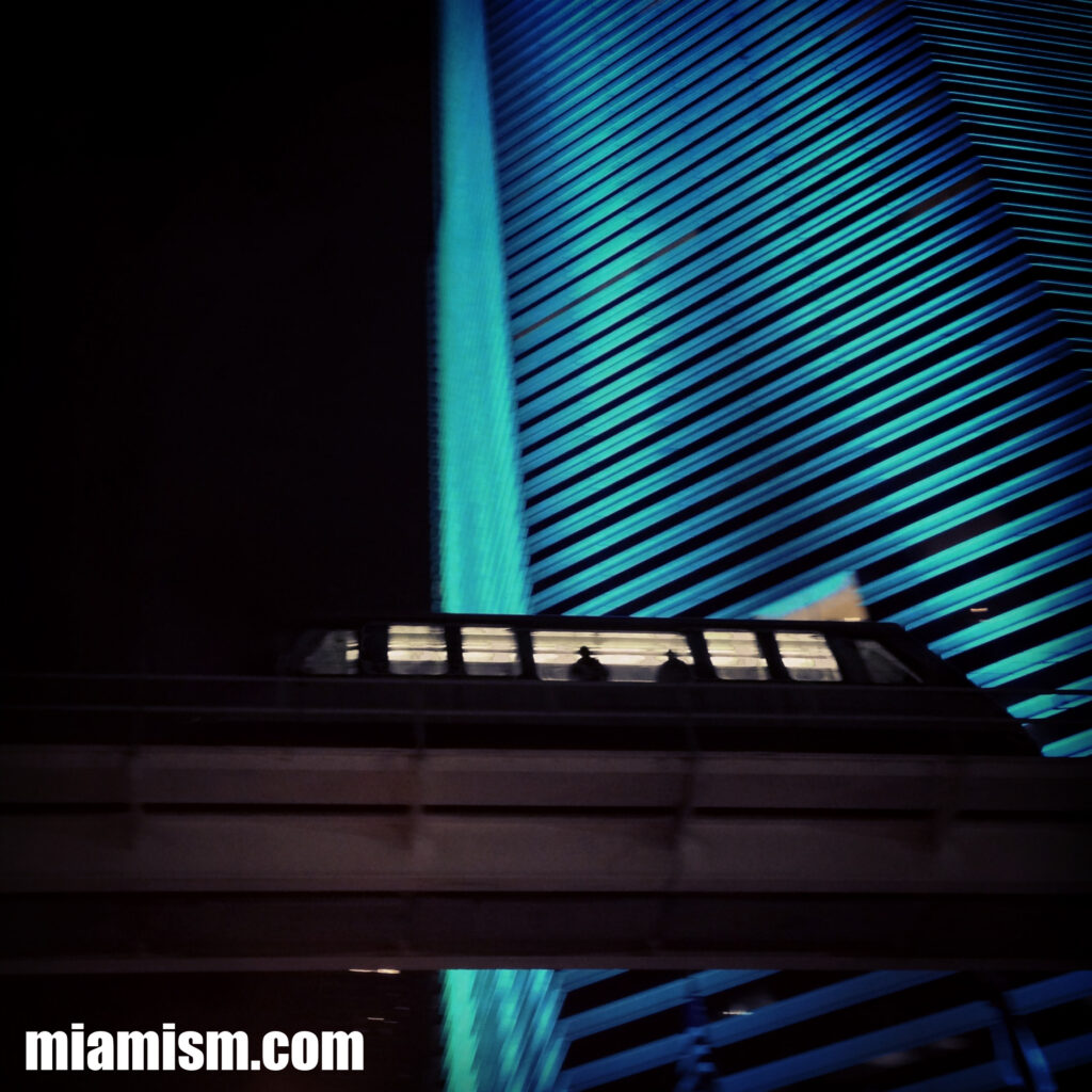 Miami Tower in Downtown Miami, the iconic skyscraper known for its colorful nighttime LED lighting and distinctive stepped design.