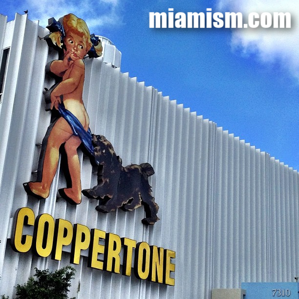 The restored Coppertone Sign in Miami's MiMo Historic District, a nostalgic roadside landmark on Biscayne Boulevard.